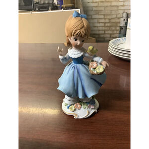 Porcelain Girl with Flower Basket and Bird Figurine